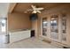 Back patio featuring tiled flooring, cabinets, a beverage fridge, and a ceiling fan at 4414 Azure Isle Way, Kissimmee, FL 34744