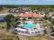 Community aerial view showcasing the pool, clubhouse, and lush green landscaping, perfect for relaxing at 601 Orange Cosmos Blvd, Davenport, FL 33837