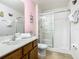 Bathroom with shower, toilet, and vanity with a large mirror at 601 Orange Cosmos Blvd, Davenport, FL 33837