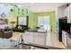 Open-concept living room featuring a kitchen and a living area with tile flooring at 601 Orange Cosmos Blvd, Davenport, FL 33837