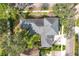 Overhead view of the house, showcasing its roof, landscaping, and surrounding neighborhood at 6244 Little Lake Sawyer Dr, Windermere, FL 34786