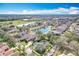 Aerial view of the neighborhood, showcasing the homes, ponds, and landscaping at 6244 Little Lake Sawyer Dr, Windermere, FL 34786