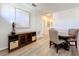 Bright dining area features wood floors, modern sideboard, and seating for four near the stairway at 6244 Little Lake Sawyer Dr, Windermere, FL 34786