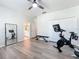 Bright exercise room with a peloton, workout bench and storage at 6244 Little Lake Sawyer Dr, Windermere, FL 34786