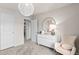 Bedroom featuring modern design, gray carpet, and a walk in closet at 7094 Rosy Sky Ave, Orlando, FL 32829