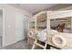 Playful room with a charming wood bunk bed and white door at 7094 Rosy Sky Ave, Orlando, FL 32829