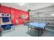 Spacious game room with ping pong table, foosball table, and basketball game at 7659 Wilmington Loop, Kissimmee, FL 34747