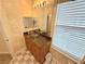 Elegant bathroom with unique glass bowl sink and granite countertops at 802 Rosa St, Celebration, FL 34747