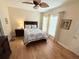 Cozy bedroom with wood floors, ceiling fan, and natural light at 802 Rosa St, Celebration, FL 34747