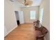 Light-filled bedroom featuring hardwood floors and a ceiling fan at 802 Rosa St, Celebration, FL 34747