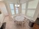 Cozy breakfast nook with window shutters and a round table at 802 Rosa St, Celebration, FL 34747