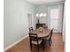 Inviting dining room features hardwood floors, plenty of space, and a stylish chandelier at 802 Rosa St, Celebration, FL 34747