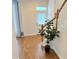 Inviting entryway with hardwood floors, staircase, and a bright white door at 802 Rosa St, Celebration, FL 34747