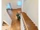 Aerial view of the foyer, featuring hardwood floors, staircase and door at 802 Rosa St, Celebration, FL 34747