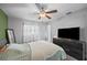 Bright bedroom with natural light, wood laminate flooring, and ceiling fan at 825 Agnes Dr, Altamonte Springs, FL 32701