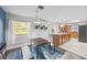 Inviting dining area adjacent to the kitchen, featuring modern lighting and views of backyard at 825 Agnes Dr, Altamonte Springs, FL 32701