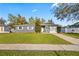 Charming single-story home with a well-manicured lawn and gray painted brick at 825 Agnes Dr, Altamonte Springs, FL 32701