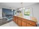 Spacious kitchen island with granite countertops and decorative pendant lighting above at 825 Agnes Dr, Altamonte Springs, FL 32701