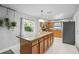 Bright kitchen featuring an island, stainless steel appliances and stone countertops at 825 Agnes Dr, Altamonte Springs, FL 32701