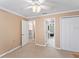 Spacious bedroom with neutral carpet, a closet, and access to both stairs and en suite at 871 Cynthianna Cir, Altamonte Springs, FL 32701