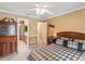 Comfortable bedroom featuring neutral walls, and a view into the en suite bathroom at 871 Cynthianna Cir, Altamonte Springs, FL 32701