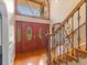 Entryway featuring wood floors, double doors with glass insets, and staircase with metal railings at 871 Cynthianna Cir, Altamonte Springs, FL 32701