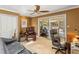 Relaxing living room with sliding glass doors leading to screened pool and plush furnishings at 871 Cynthianna Cir, Altamonte Springs, FL 32701