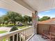 Cozy porch features wood floors, a wood railing, and stunning neighborhood views at 871 Cynthianna Cir, Altamonte Springs, FL 32701