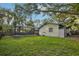 The backyard features a screen enclosed pool, shed, and lush lawn at 101 Ludlow Dr, Longwood, FL 32779