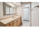 The bathroom has a vanity with sink, framed mirror, and a shower with white curtain at 101 Ludlow Dr, Longwood, FL 32779