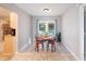 Cozy dining area with a table set for four and direct access to the screened-in pool via French doors at 101 Ludlow Dr, Longwood, FL 32779