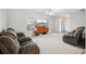 Bright living room with neutral paint, plush carpeting, and large windows providing ample natural light at 101 Ludlow Dr, Longwood, FL 32779
