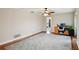 This office features hardwood floors with a geometric area rug, desk, and a ceiling fan at 101 Ludlow Dr, Longwood, FL 32779