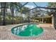 Beautiful screened-in pool with brick pavers and lush landscaping, perfect for relaxation and entertainment at 101 Ludlow Dr, Longwood, FL 32779