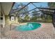 Screened-in backyard pool with brick pavers and stainless steel railing at 101 Ludlow Dr, Longwood, FL 32779