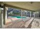 A covered pool with brick patio and screen enclosure provides a relaxing outdoor retreat at 101 Ludlow Dr, Longwood, FL 32779
