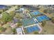 Aerial view of community amenities including swimming pool, tennis courts, basketball courts, and playground at 102 Spanish Moss Ct, Orlando, FL 32828