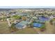 Aerial view of community recreational amenities including tennis courts, a basketball court, pool, and clubhouse at 102 Spanish Moss Ct, Orlando, FL 32828