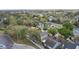 Aerial view of a residential neighborhood with mature trees and neatly kept homes, showcasing the property's location at 102 Spanish Moss Ct, Orlando, FL 32828