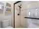 Modern bathroom features glass shower with tile surround, floating shelves, and a dual showerhead at 102 Spanish Moss Ct, Orlando, FL 32828