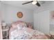 Adorable pink bedroom decorated with a full bed, soft decor, and natural light at 102 Spanish Moss Ct, Orlando, FL 32828