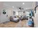 Bright living room with tile floors, crown molding, and comfortable seating with lots of natural light at 102 Spanish Moss Ct, Orlando, FL 32828