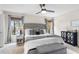 Tastefully decorated main bedroom with neutral tones, a tufted headboard, and ample natural light at 102 Spanish Moss Ct, Orlando, FL 32828