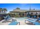 Community recreation area features a small pool with lounge chairs and tropical landscaping at 102 Spanish Moss Ct, Orlando, FL 32828