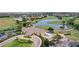 Aerial view of community clubhouse and golf course with ponds at 10236 Beechwood Ln, Orlando, FL 32832