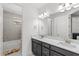 Bathroom featuring double sinks, granite counters, modern fixtures and a tiled shower/tub combo at 10236 Beechwood Ln, Orlando, FL 32832