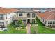 Beautiful two-story home showcases stone detailing, a well-kept lawn, and an inviting pathway at 10236 Beechwood Ln, Orlando, FL 32832