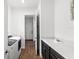 Functional laundry room with dark wood cabinets, granite countertops, and modern washer/dryer at 10236 Beechwood Ln, Orlando, FL 32832