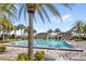 Gorgeous swimming pool area with cabanas and lounge chairs, surrounded by tall palm trees creating a relaxing oasis at 10236 Beechwood Ln, Orlando, FL 32832