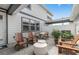 Cozy outdoor patio with pavers, ample seating, and a decorative white fence at 10274 Hadley St, Orlando, FL 32829